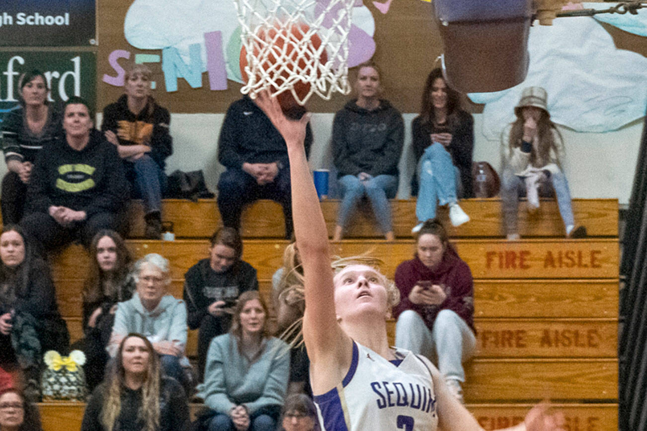 Sequim’s Jolene Vaara goes to the basket for two of her team-high 20 points in a 64-49 Olympic League win over North Kitsap. Vaara had six 20-point games and was named the Olympic League MVP and defensive player of the year. (Emily Matthiessen/Olympic Peninsula News Group)