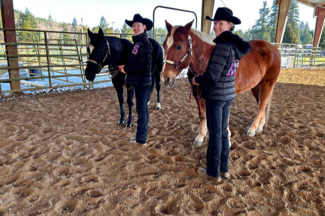 Sequim Equestrian Team won 1st place in 10 events at its second of three Washington High School Equestrian Team meets, held Feb. 24-26, at Grays Harbor Fairgrounds indoor area. Competing with borrowed horses in Showmanship were Katelynn Sharp, left, with Nikki (coach Keri’s horse) and Celbie Karjalainen with Pistol.Sequim Equestrian Team won 1st place in 10 events at its second of three Washington High School Equestrian Team meets, held Feb. 24-26, at Grays Harbor Fairgrounds indoor area. Competing with borrowed horses in Showmanship were Katelynn Sharp, left, with Nikki (coach Keri’s horse) and Celbie Karjalainen with Pistol (Coach Katie’s horse). (Photo courtesy of KATIE SALMON-NEWTON)