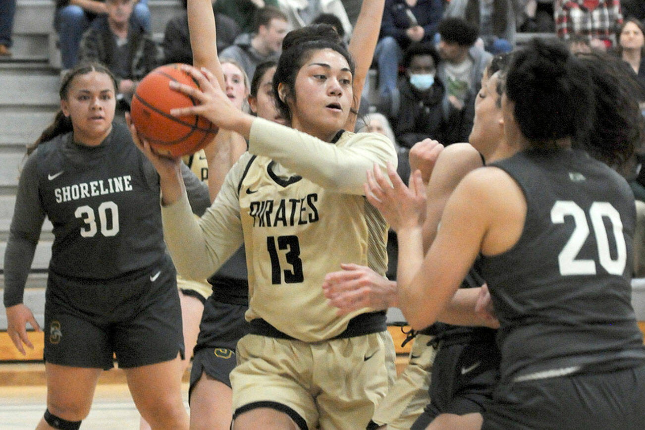 Keith Thorpe/Peninsula Daily News
Peninsula's Ituau Tuisaula, center, looks to pass surrounded by Shoreline defenders, including, from left, Leiah Naeata, Taylor Eldredge and Moemanogi Notoa on Saturday in Port Angeles.