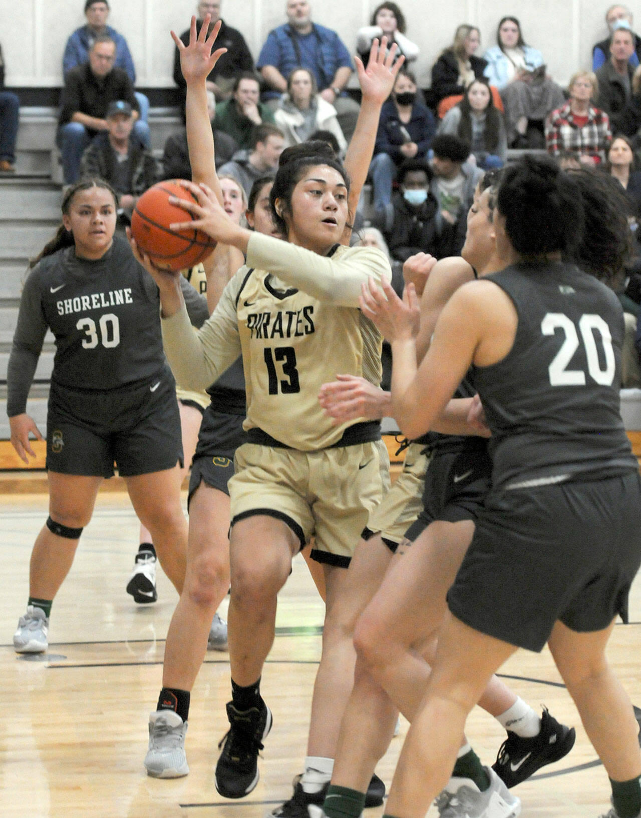 Peninsula’s Ituau Tuisaula, center, looks to pass surrounded by Shoreline defenders, including, from left, Leiah Naeata, Taylor Eldredge and Moemanogi Notoa on Saturday in Port Angeles. (Keith Thorpe/Peninsula Daily News)