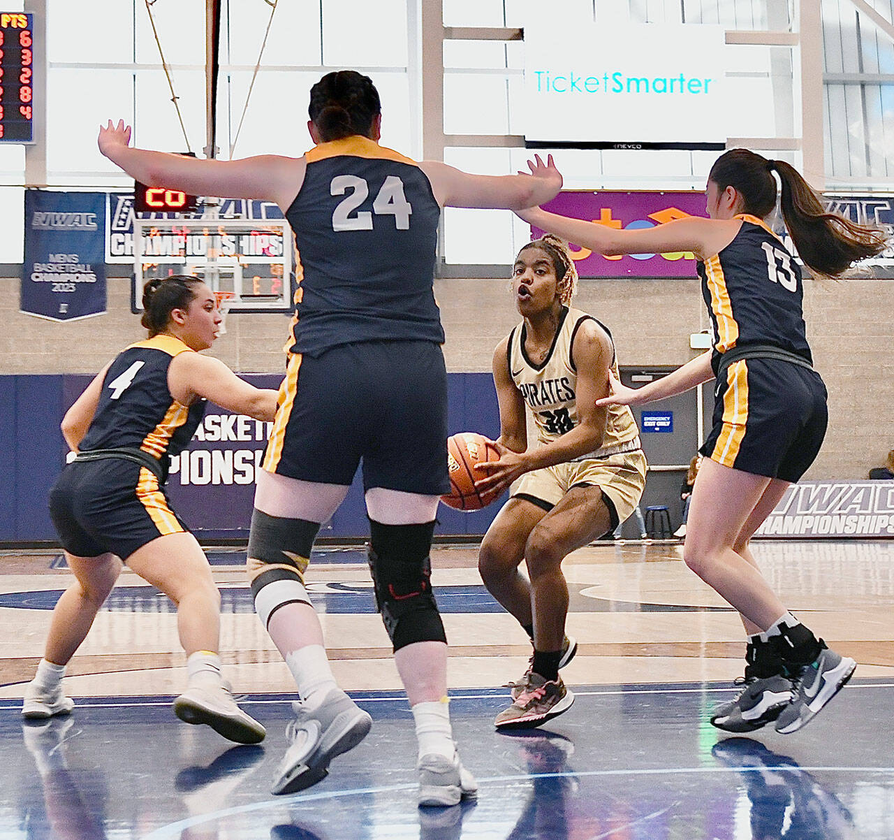 Peninsula’s Chasity Selden is surrounded by a triple team from Linn-Benton during the Pirates’ NWAC Women’s Basketball Tournament contest at Columbia Basin College on Thursday. (Jay Cline/for Peninsula College)
