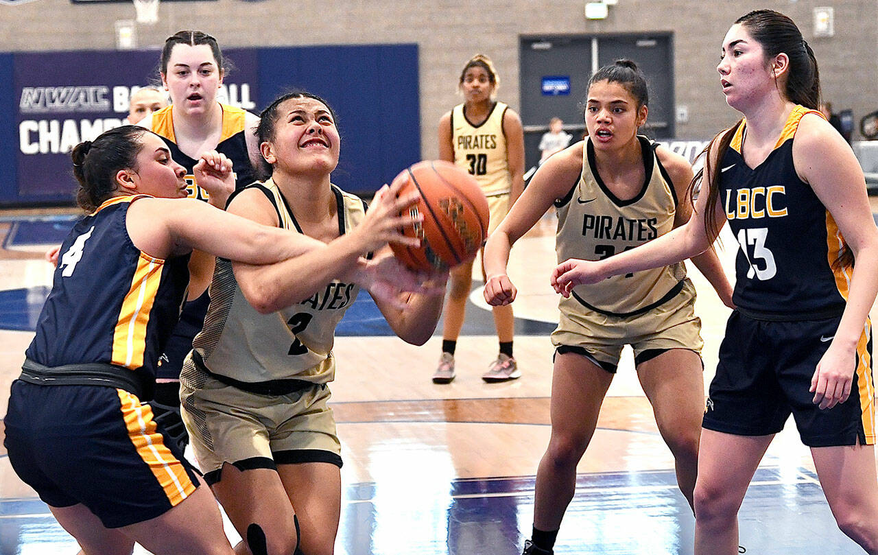Peninsula’s Tati Kamae is fouled by Linn-Benton’s Ruby Krebs during the first half of the Pirates’ NWAC Women’s Basketball Tournament game at Columbia Basin College in Pasco on Thursday. (Jay Cline/for Peninsula College)