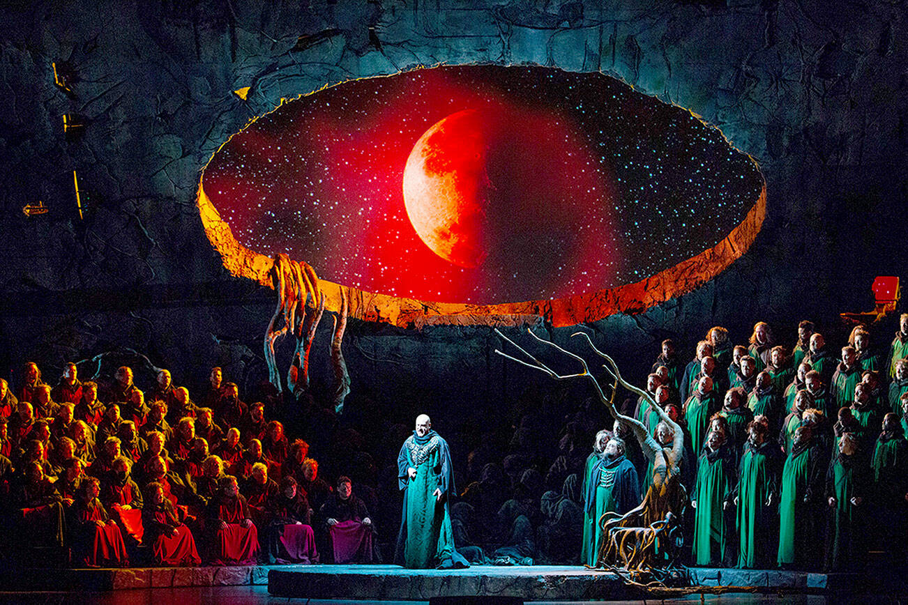 In the Metropolitan Opera production of "Lohengrin," Günther Groissböck portrays King Heinrich. In this scene, a window to the celestial realm of the Holy Grail has opened. photo courtesy the Metropolitan Opera