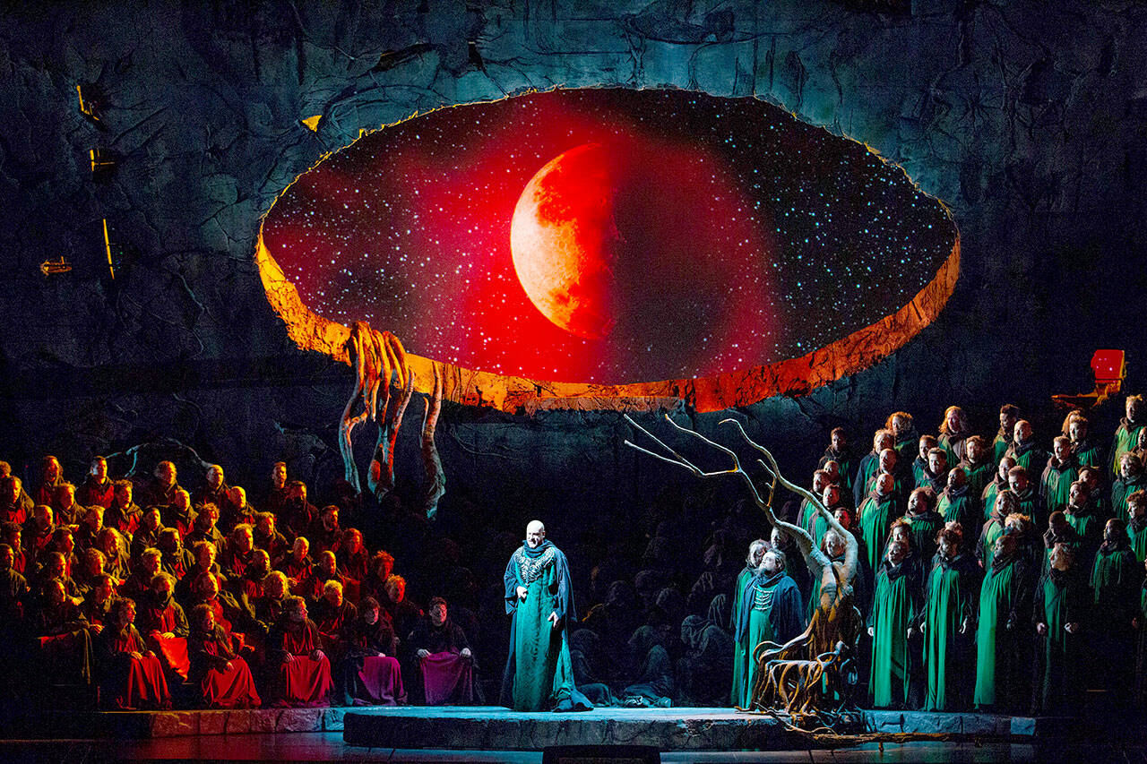 In the Metropolitan Opera production of “Lohengrin,” Günther Groissböck portrays King Heinrich. In this scene, a window to the celestial realm of the Holy Grail has opened. (photo courtesy the Metropolitan Opera)