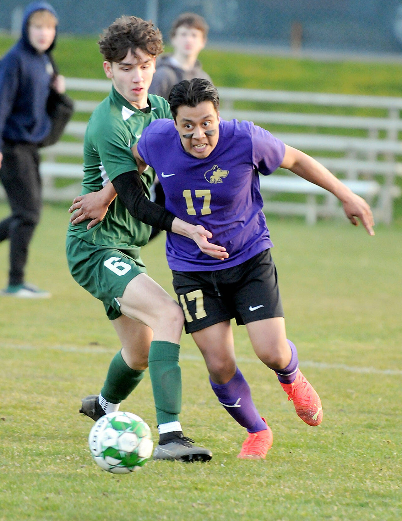 KEITH THORPE/PENINSULA DAILY NEWS Sequim’s Abe Torres, right, and Port Angeles’ Keane McClain spar for the ball during Thursday night’s match at Port Angeles Civic Field.