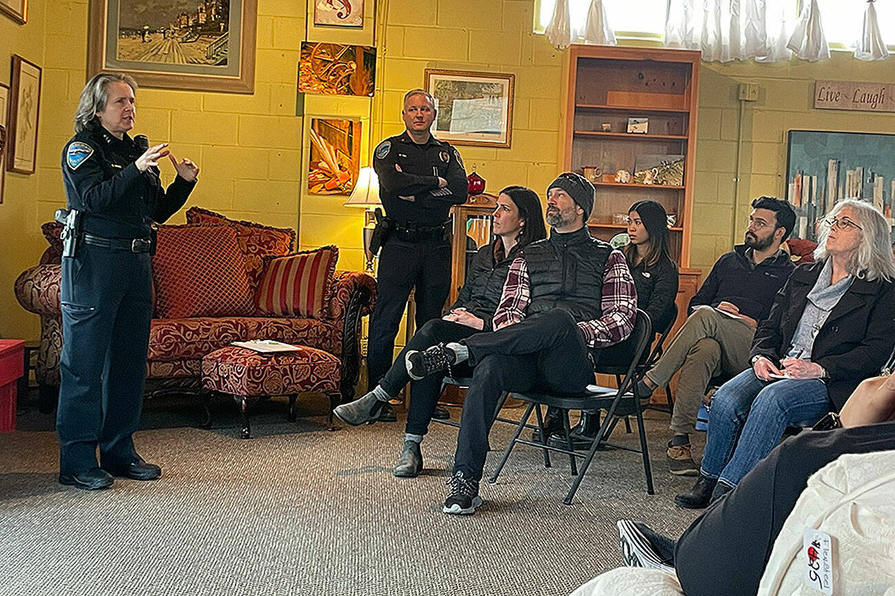 Matthew Nash/ Olympic Peninsula News Group

Sequim Police Chief Sheri Crain talks with a crowd at a Sequim Business Merchants meeting. She encouraged people to call police if they see something suspicious.