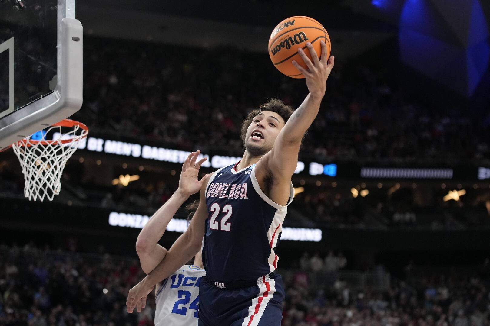 Gonzaga's Anton Watson (22) reaches for the ball in the second half of a Sweet 16 college basketball game against UCLA in the West Regional of the NCAA Tournament, Thursday, March 23, 2023, in Las Vegas. (AP Photo/John Locher)