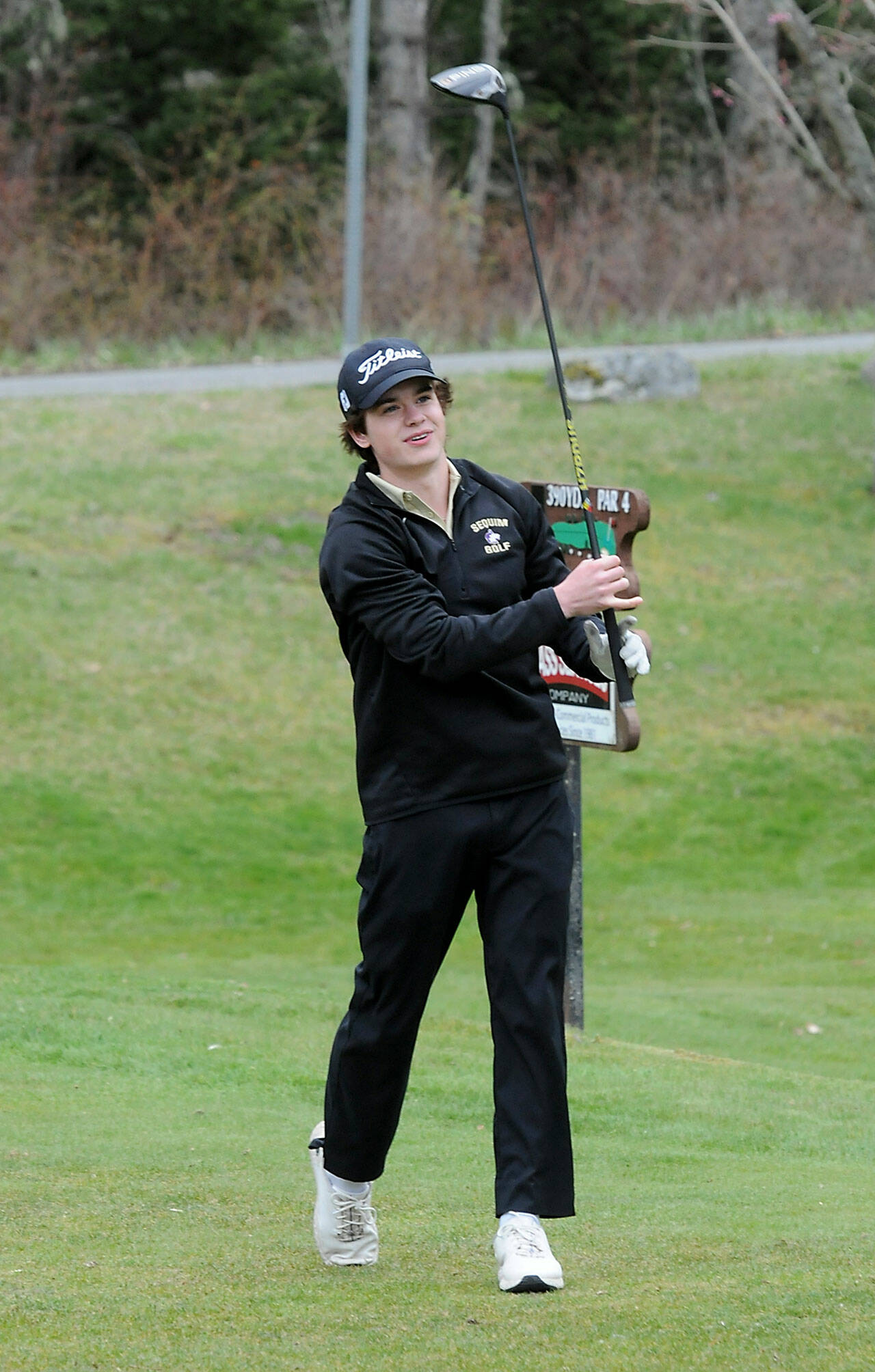 KEITH THORPE/PENINSULA DAILY NEWS Sequim’s Carter Cronin takes his shot from the first hole at Peninsula Golf Course on Thursday.