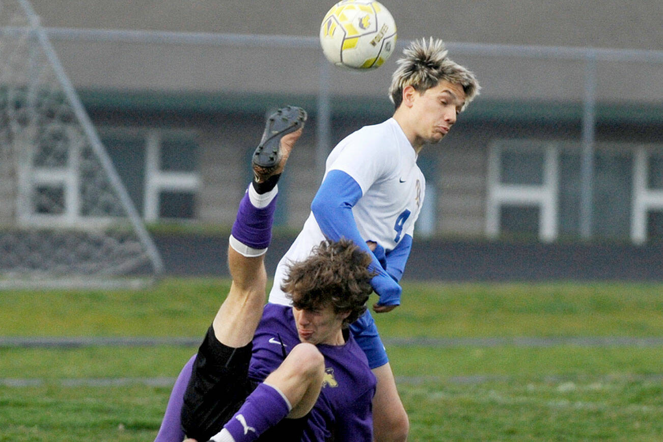 Michael Dashiell/Olympic Peninsula News Group
Sequim's Lake Barrett bicycle kicks the ball over a Bremerton defender during the Wolves' 2-0 loss at home Thursday.