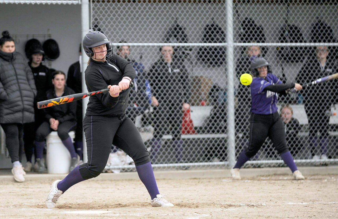 Michael Dashiell/Olympic Peninsula News Group Sequim’s Mia Pozernick squares up on a pitch during the Wolves 10-8 softball victory over North Mason in Sequim on Thursday.