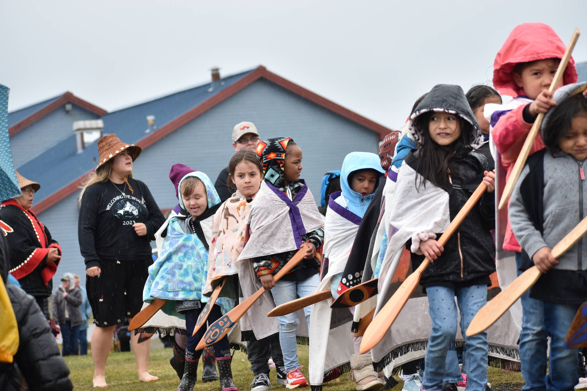 Students at the Quileute Tribal School take part in a paddle song during the Welcoming the Whales ceremony. (Clayton Franke/The Daily World)
