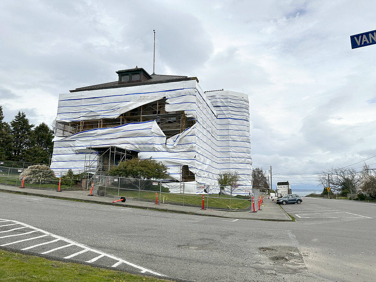 The post office building in Port Townsend, covered with protective plastic while undergoing renovation work, is buffeted by gale force winds on Sunday strong enough to rip the covering. (Steve Mullensky/for Peninsula Daily News)