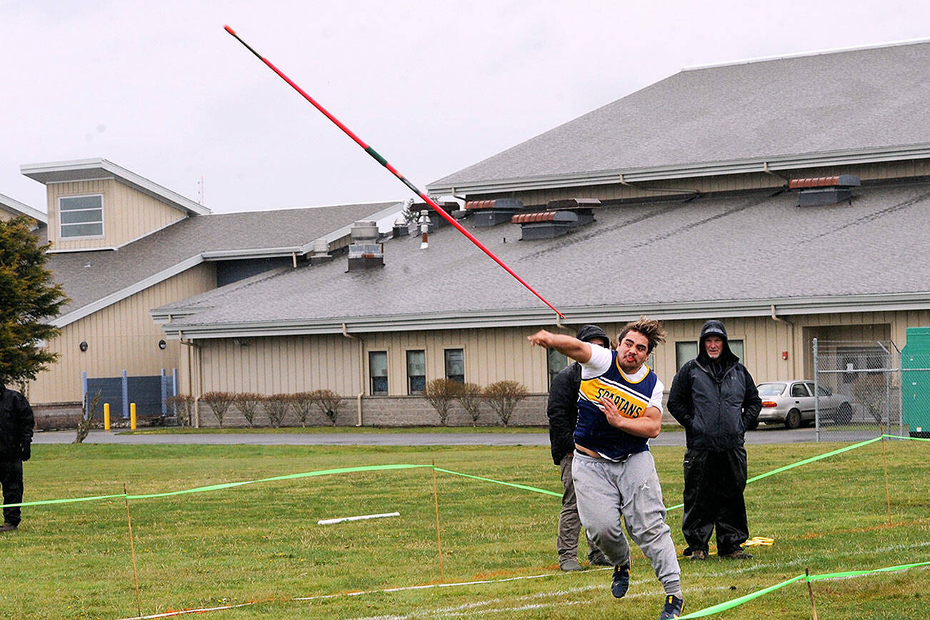 Forks' Sloan Tumaua competes in the javelin throw Saturday at Spartan Stadium in this Forks Lions Club sponsored track and field meet.  Photo by Lonnie Archibald.