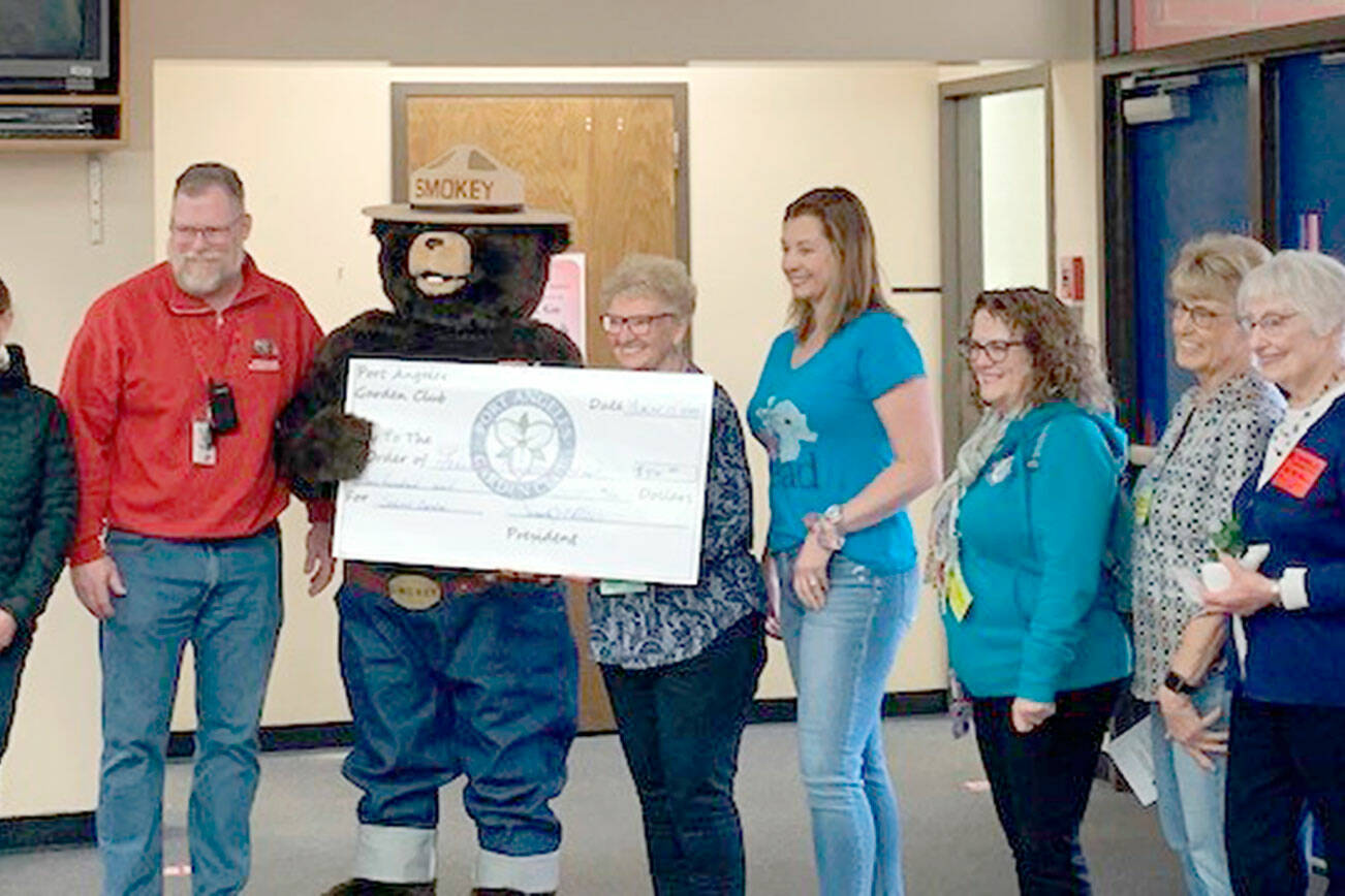 The Port Angeles Garden Club recently donated $500 to Jeff Lunt, the principal at Franklin Elementary School, and teacher Sarah Schaefermeyer for a garden at the school. 

The club was at the school with Smokey Bear and several Department of Natural Resources employees to award prizes to the winners for the Smokey Bear and Woodsy Owl drawing contest. 

Pictured, from left to right, are Carmen Geyer, Jeff Lunt, Smokey T. Bear, Linda Skolnik, Sarah Schaefermeyer, Darlene Martin and Jane Marks.