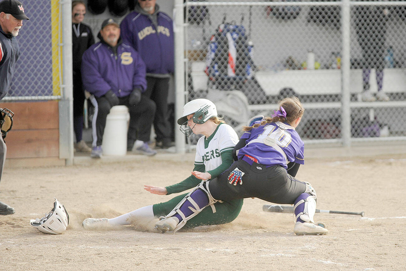 Michael Dashiell/Olympic Peninsula News Group
Sequim catcher Mikki Green blocks the plate and applies the tag on Port Angeles base runner Alexandria Money during the Wolves' 7-6 softball win on Tuesday.