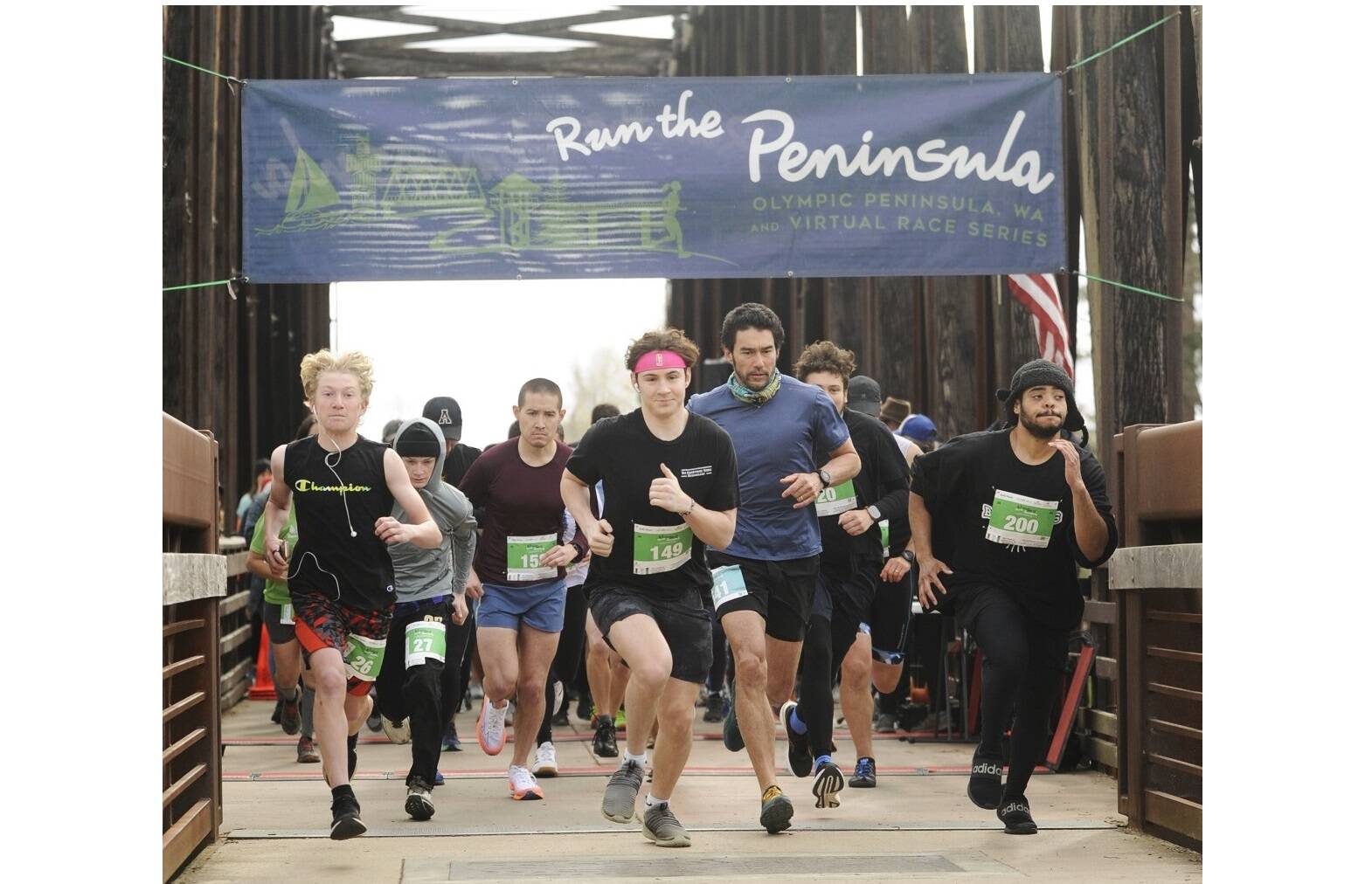 Nearly 300 runners take off in the Run the Peninsula's Sequim Railroad Bridge run Saturday morning. (Michael Dashiell/Olympic Peninsula News Group)