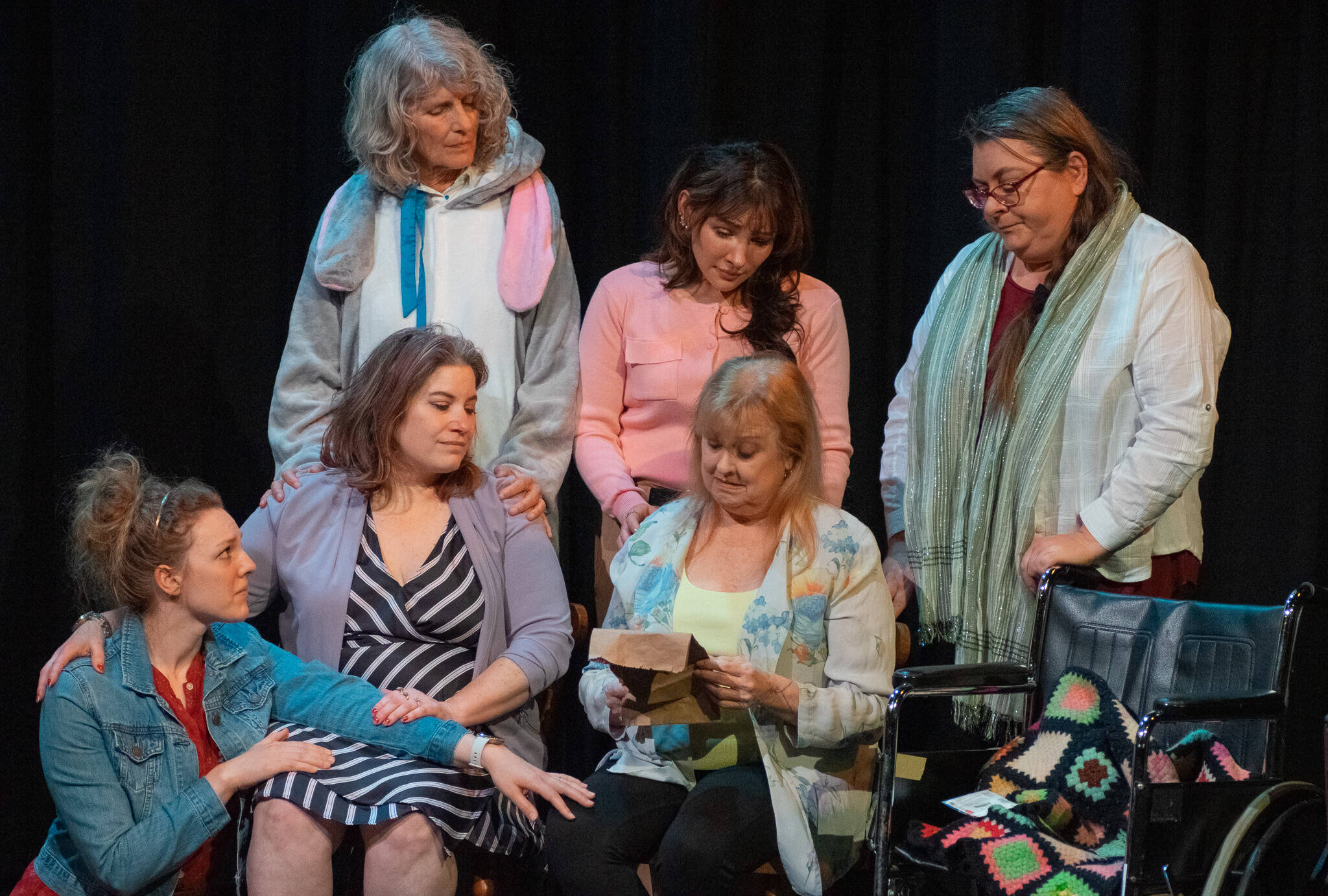 Front, from left to right, Merrin Packer, Taryn Dupont, Cheryl DiPietro and, behind, Cheryl Tamblyn, Jamie Pauley and Amy Henry participate in a poignant scene in “Calendar Girls,” Olympic Theatre Arts’ newest production. (Emily Matthiessen/Olympic Peninsula News Group)