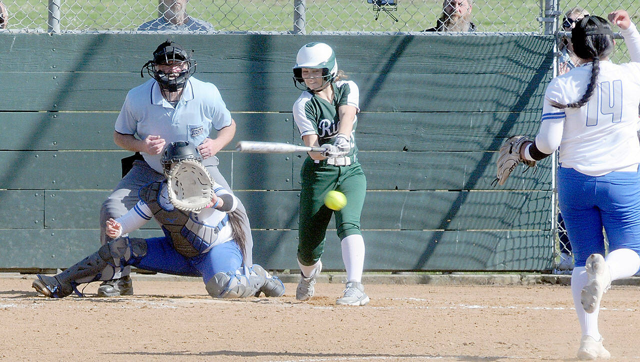 KEITH THORPE/PENINSULA DAILY NEWS Port Angeles’ Kennedy Rognlien swings in the third inning as Olympic catcher Beya Richmond waits for the delivery from pitcher Brenda Morrison on Thursday at Dry Creek Elementary in Port Angeles.