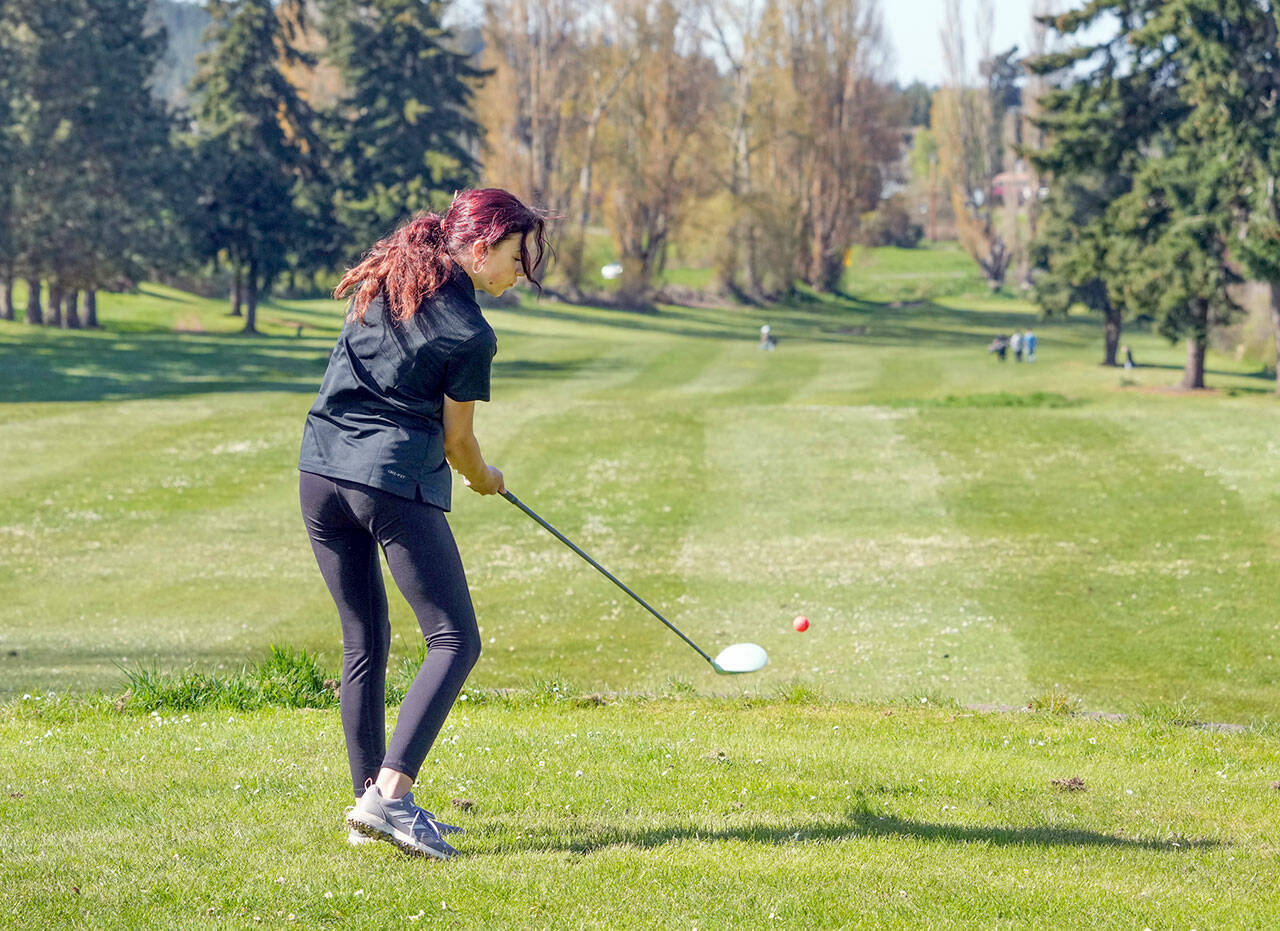 Steve Mullensky/for Peninsula Daily News East Jefferson’s Sophie Heistand tees off on the first hole during the Port Townsend Invitational Golf Tournament held at Port Townsend Golf Course on Thursday.