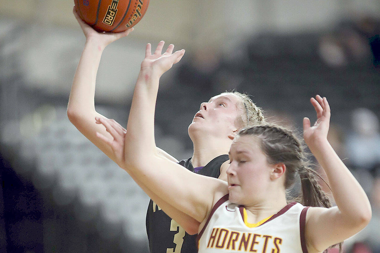 David Willoughby/for Peninsula Daily News
Sequim's Jolene Vaara puts up a layup while fending off the defense of White River's Dakota Sprouse during their Class 2A state quarterfinal at the Yakima SunDome on Thursday night.