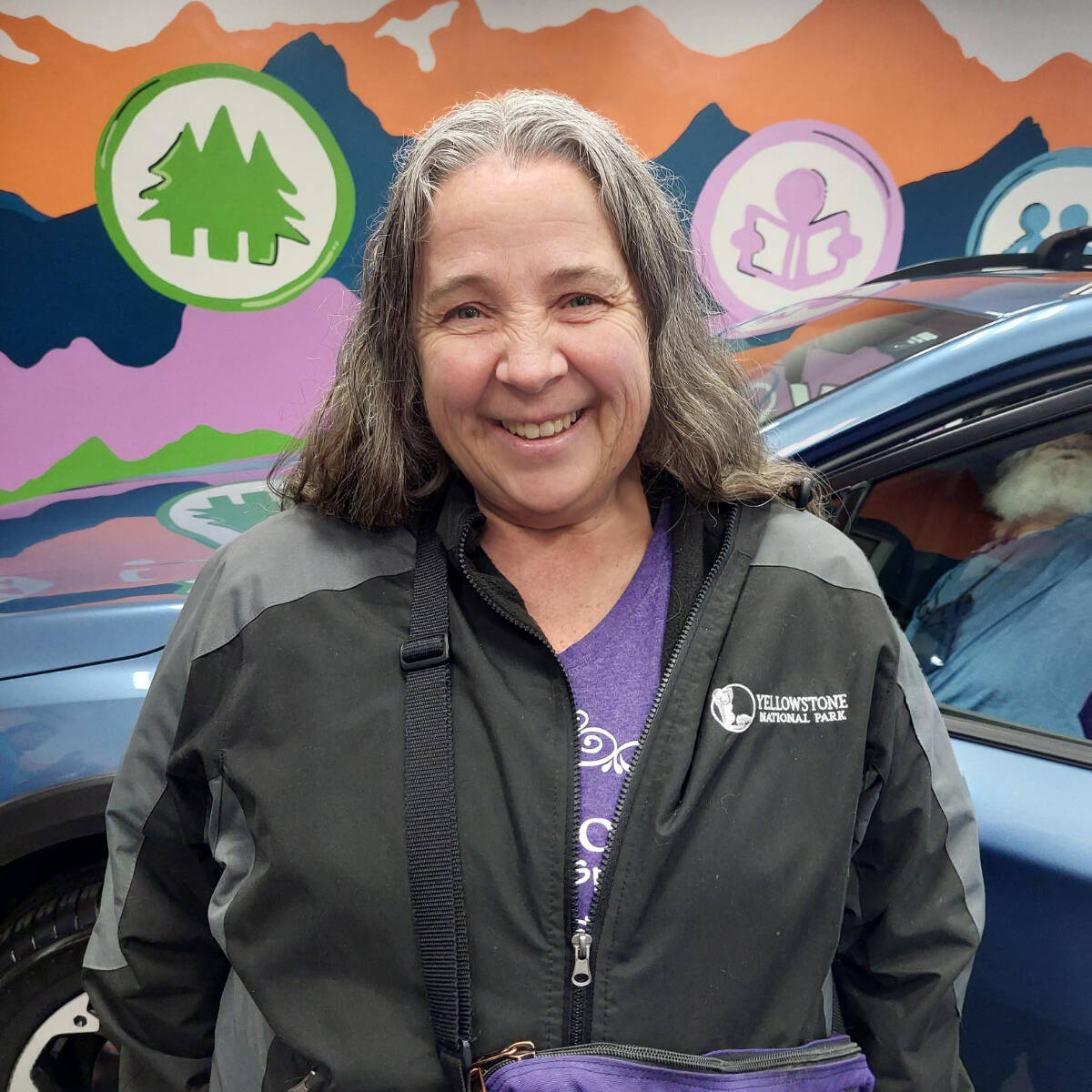 Bradshaw with her new Subaru, after being approved for an auto loan. First Fed photo