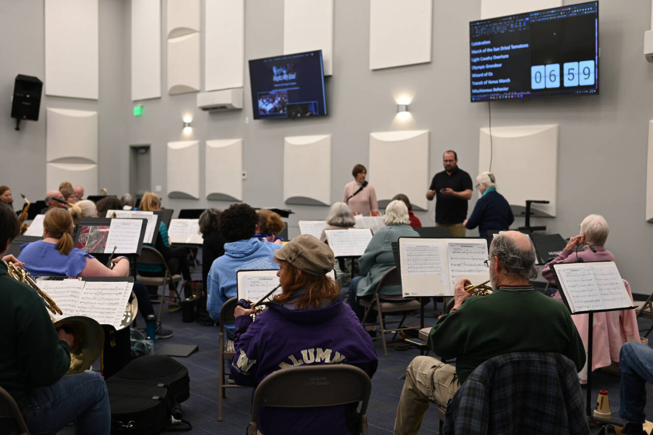 Sequim City Band members assemble for their first rehearsal in the new rehearsal hall at the James Center. The hall features a high ceiling, acoustical tiles on the walls and wall-mounted monitors for displaying key information. (Photo by Richard Greenway/Sequim City Band)