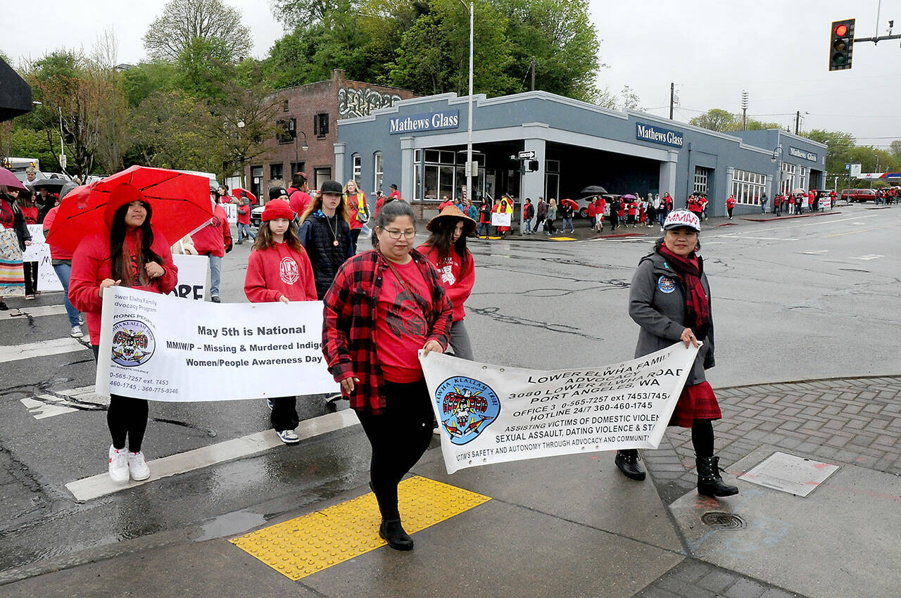 Iliana Jones, left, and Beatriz Arakawa lead a march from from Vern Burton Community Center to The Gateway in Port Angeles on Friday to observe National Day of Awareness for Missing and Murdered Indigenous Women and Girls. (KEITH THORPE/PENINSULA DAILY NEWS)