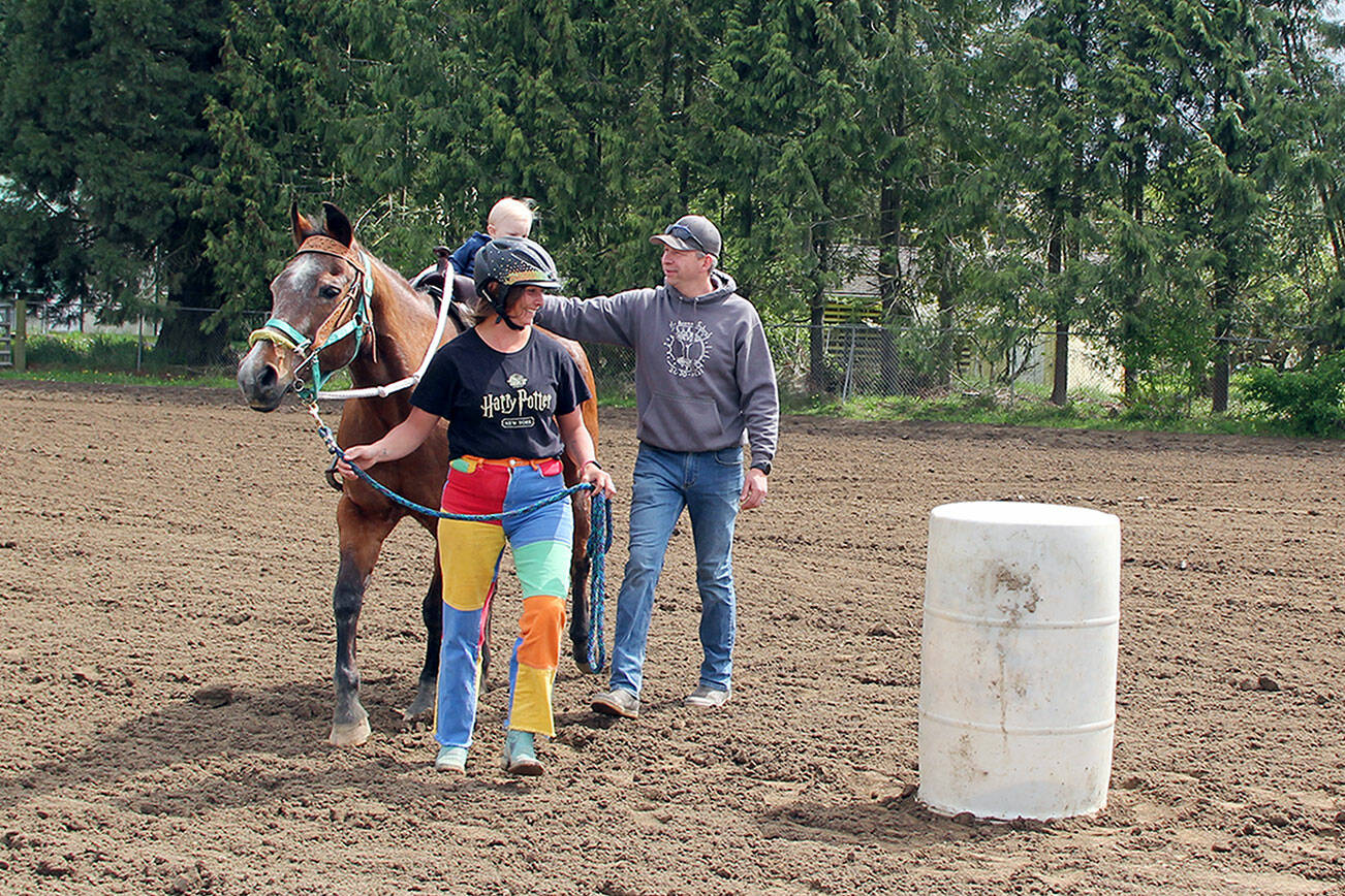 Photo by Karen Griffiths

At a May 6 Patterned Speed Horse game show honoring his great-grandfather Ted Crosby, a very young Nyle Crosby James is led through his first competitive barrel racing pattern by his mother, Ady Crosby, while steadied by his father Jeff James. Crosby, 87 passed away March 30 of complications of prostate cancer.