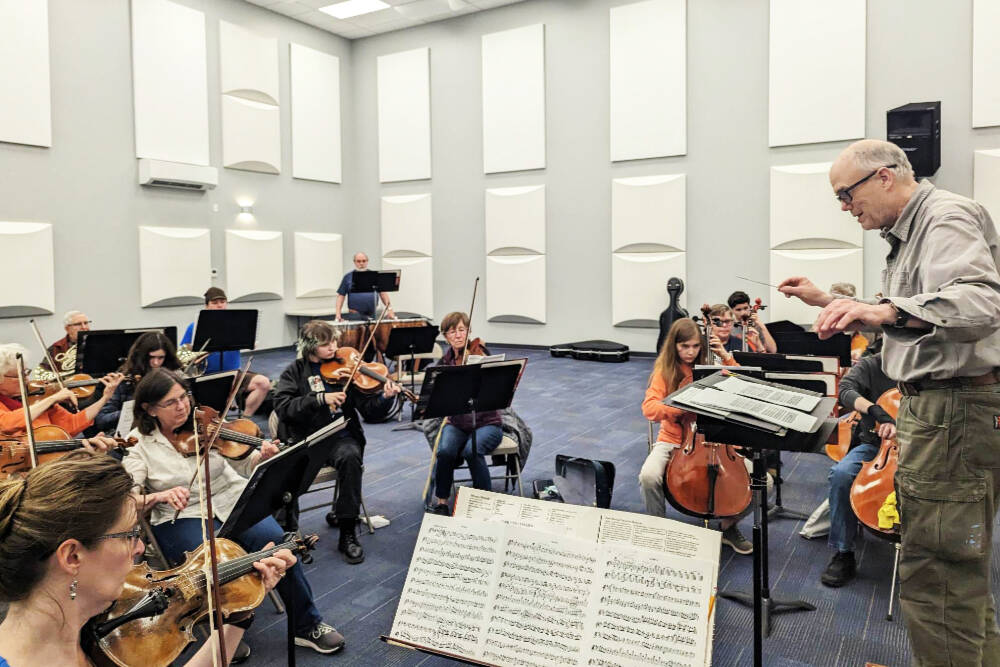 Photo courtesy of Sequim Community Orchestra / Conductor/music director Phil Morgan-Ellis leads a Sequim Community Orchestra rehearsal on April 25 at the Sequim City Band' expanded rehearsal hall at the James Center for Performing Arts.