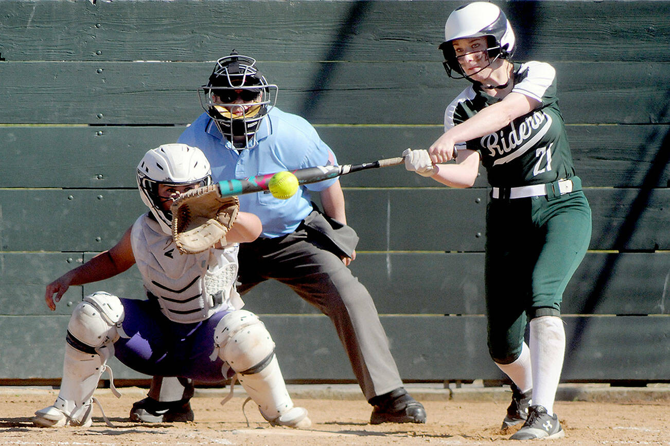 KEITH THORPE/PENINSULA DAILY NEWS
Port Angeles' Ava-Anne Sheahan bats in the second inning as Sequim catcher Mikki Green waits for the delivery on Friday in Port Angeles.