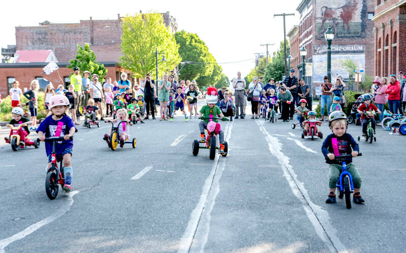 Trike races in the 3- and 4-year-old class make a dash for the finish line during the Rhody Festival Trike Races on Water Street in downtown Port Townsend on Wednesday. (Steve Mullensky/for Peninsula Daily News)
