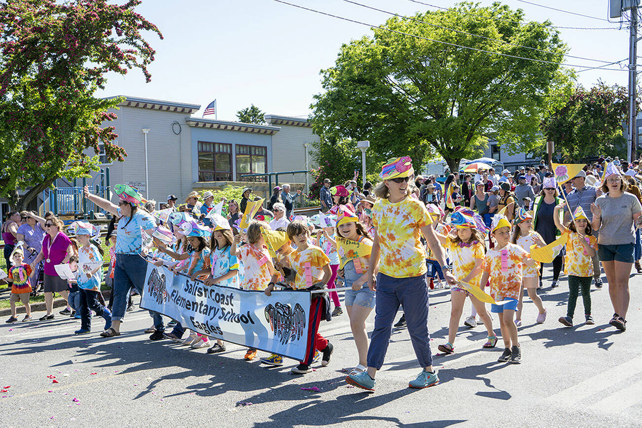 Steve Mullensky/for Peninsula Daily News

The Salish Coast Elementary School Eagles march along Lawrence Street in Uptown Port Townsend in the annual Rhody Kiddies Parade on Saturday. Over 600 kids were registered for the parade.