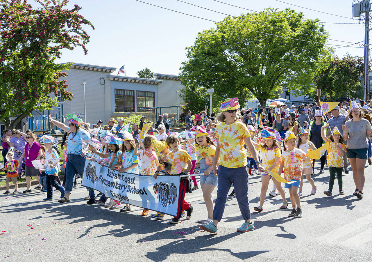 The Salish Coast Elementary School Eagles march along Lawrence Street in Uptown Port Townsend in the annual Rhody Kiddies Parade on Saturday. (Steve Mullensky/for Peninsula Daily News)