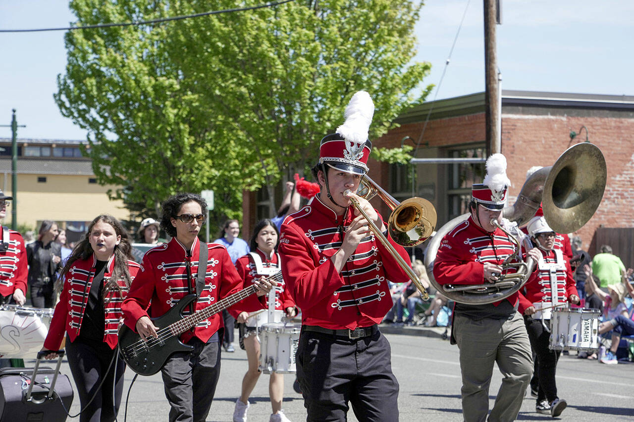 Members of the Port Townsend High School band perform while marching along Water Street in downtown Port Townsend on Saturday during the 2023 Rhody Parade. (Steve Mullensky/for Peninsula Daily News)