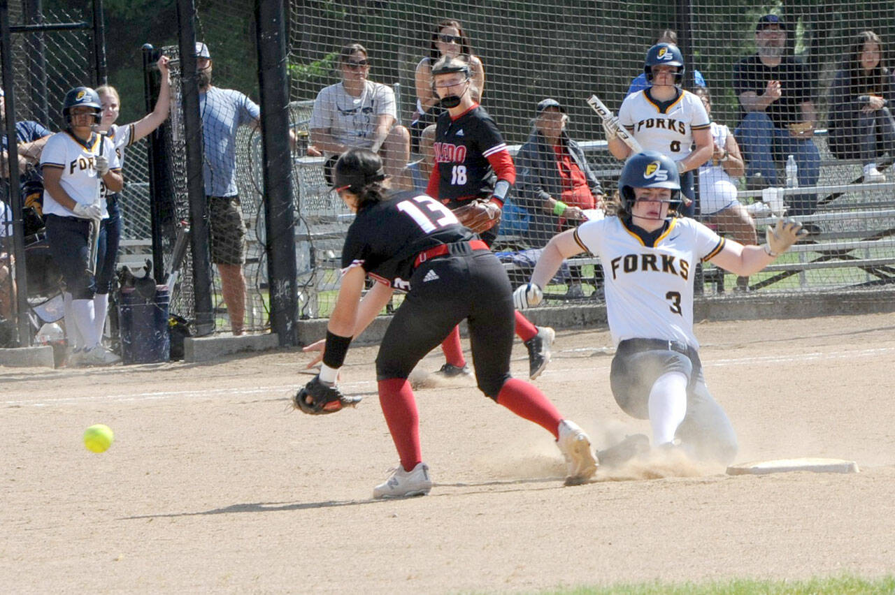 Forks’ Keira Johnson steals second well ahead of the throw to Toledo’s Candance Clark Saturday in Fort Borst Park in Centralia, where Forks defeated the Riverhawks 4-2, earning a trip to the state tournament. (Lonnie Archibald/for Peninsula Daily News)