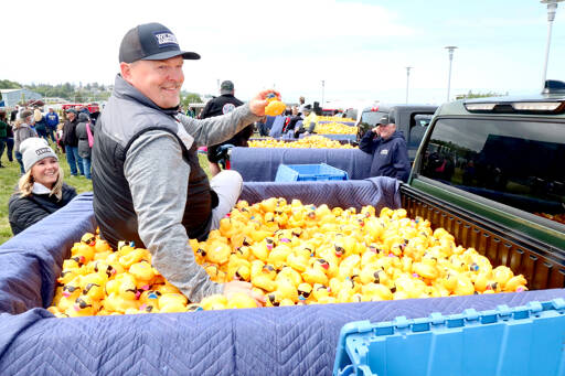 Dan Wilder Jr. pulls the winning duck from a Wilder truck at the 34th annual Great Olympic Duck Derby on Sunday. (Dave Logan/for Peninsula Daily News)