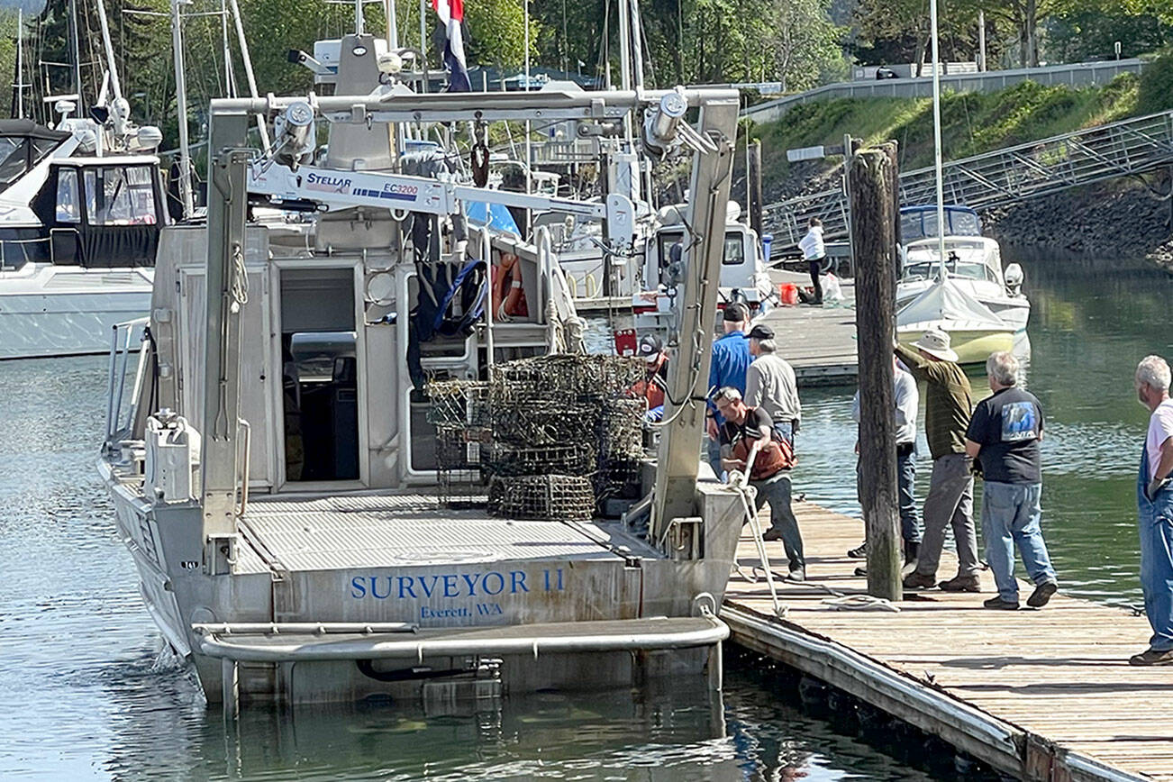 North Olympic Chapter of Puget Sound Anglers

North Olympic Chapter of Puget Sound Anglers members greet the arrival of the first derelict crab pots to be removed from Sequim and Discovery bays last Saturday. Crab pot removal will continue through June 15.
