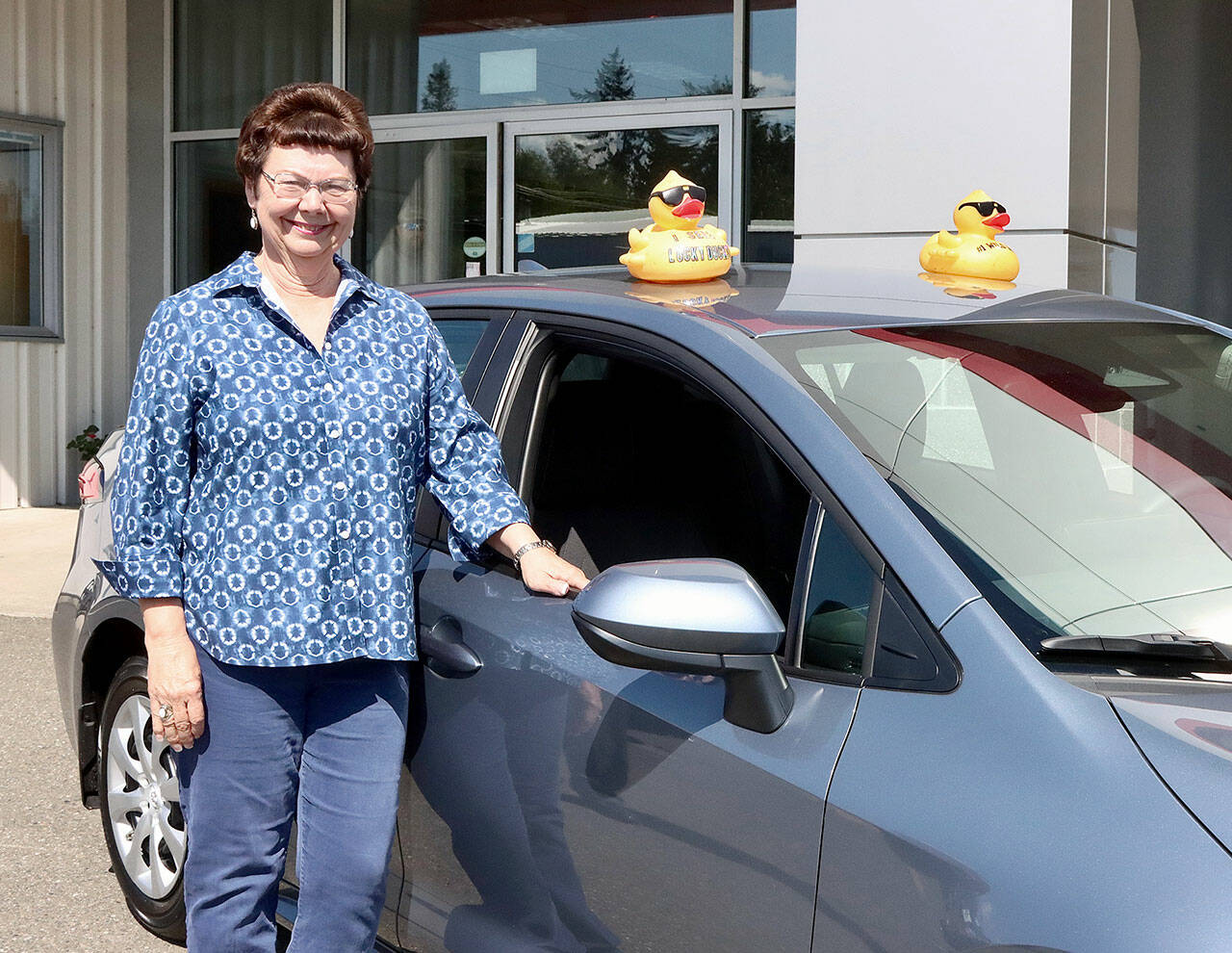 Kay Hermann of Port Angeles poses with her 2023 Toyota Corolla from Wilder Toyota. (Dave Logan/for Peninsula Daily News)