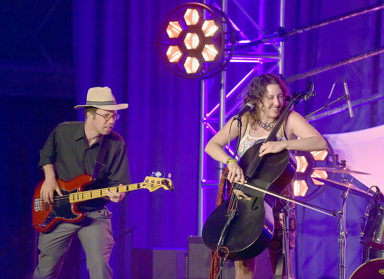Frontwoman Rebecca Roudman of Novato, Calif., right, and bassist Colin Williams perform with Dirty Cello on the Main Stage at Vern Burton Community Center on Saturday at the Juan de Fuca Festival. (Keith Thorpe/Peninsula Daily News)