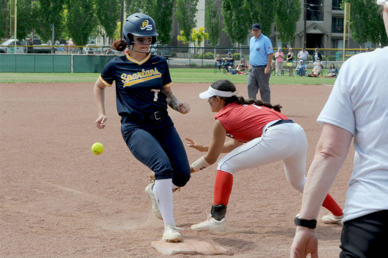 Forks' Haven Hoffman steals  third base against the Brewster Bears in Yakima this weekend. The Spartans beat Brewster 13-5 and made it all the way tot he 2B state championship game. (Lonnie Archibald/for Peninsula Daily News)