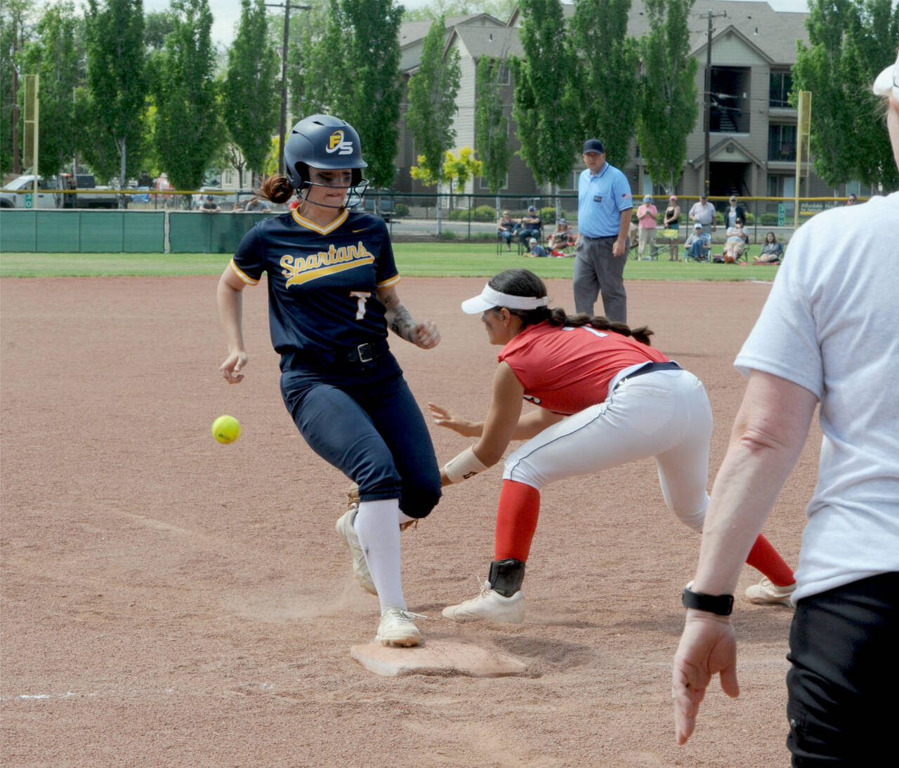 Forks’ Haven Hoffman steals third base against the Brewster Bears in Yakima this weekend. The Spartans beat Brewster 13-5 and made it all the way tot he 2B state championship game. (Lonnie Archibald/for Peninsula Daily News)