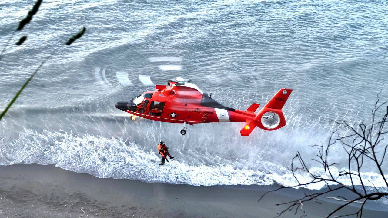 A helicopter from the Coast Guard station in Port Angeles assists in the rescue. (Clallam County Sheriff’s Office)