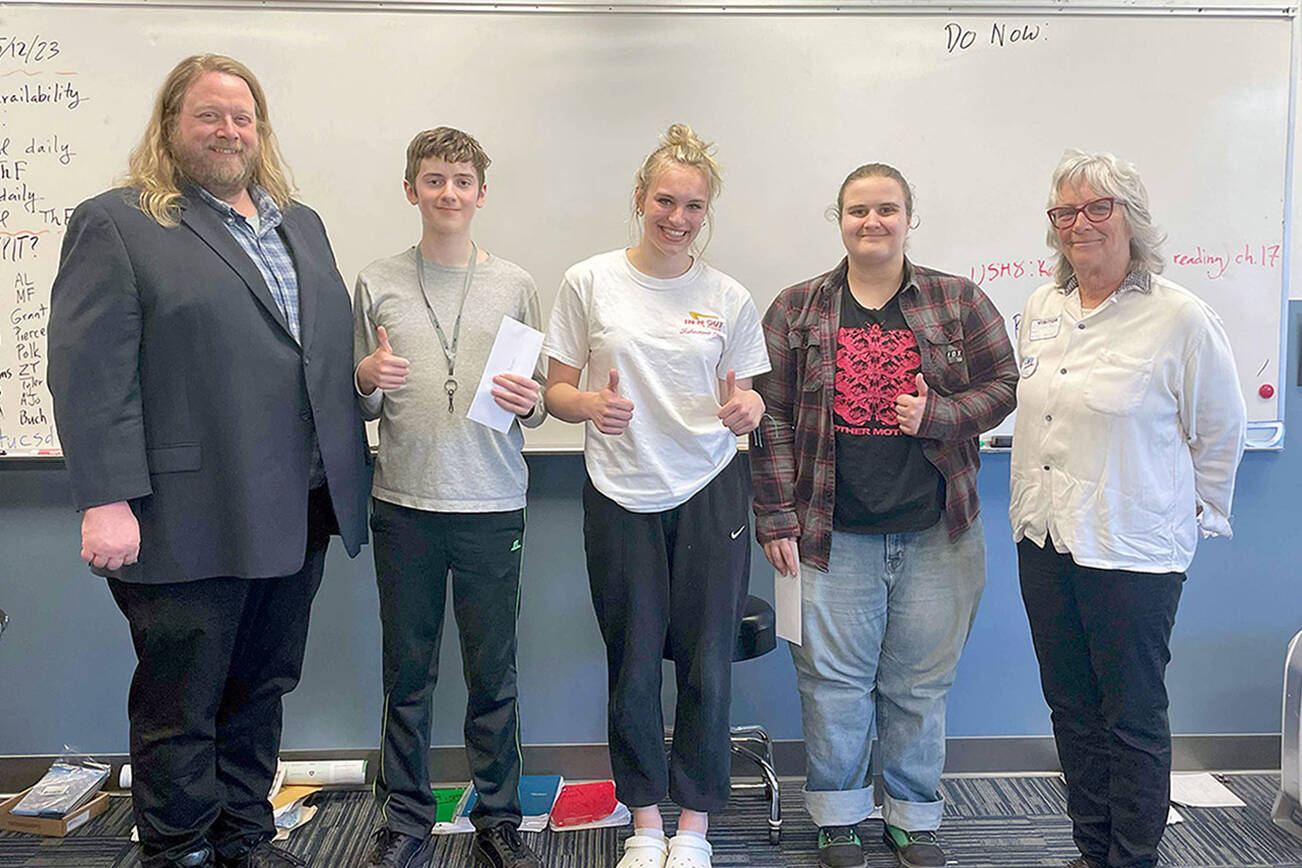 Pictured, from left to right, are Chimcum High School teacher Brian MacKenzie, Keanu Morrison Tessa Richardson, Elliot Pflueger and League of Women Voters essay team organizer, Jackie Aase.