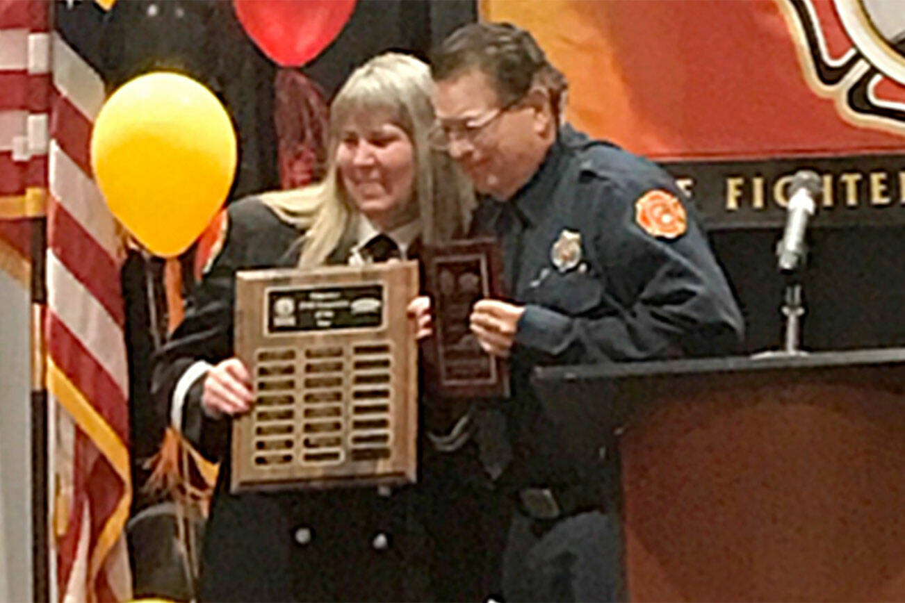 Blaine Zechenelly receives the Washington Volunteer EMS Responder of the Year award on May 20 at the Washington State Fire Fighters’ Association’s (WSFFA) 100th anniversary conference in Wenatchee. (Clallam County Fire District 3)