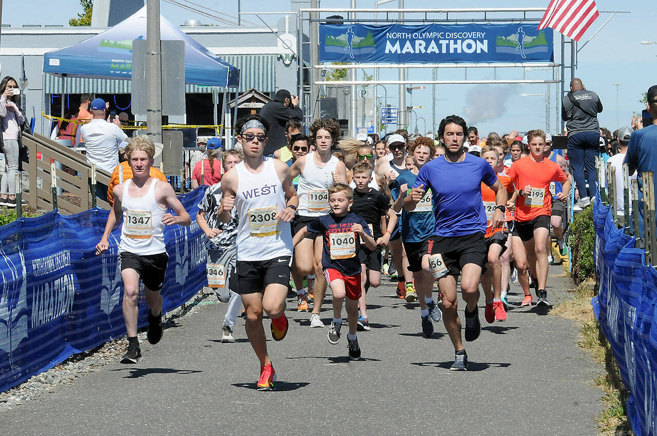 Runners take off from Port Angeles City Pier at the start of Saturday’s combined 5k and 10k runs, the opening races of the Olympic Discovery Marathon. In the front center is the 10K winner Kaeden Peterson of Kingston. (Keith Thorpe/Peninsula Daily News)
Runners take off from Port Angeles City Pier at the start of Saturday’s combined 5k and 10k runs, the opening races of the Olympic Discovery Marathon. In the front center is the 10K winner Kaeden Peterson of Kingston. (Keith Thorpe/Peninsula Daily News)