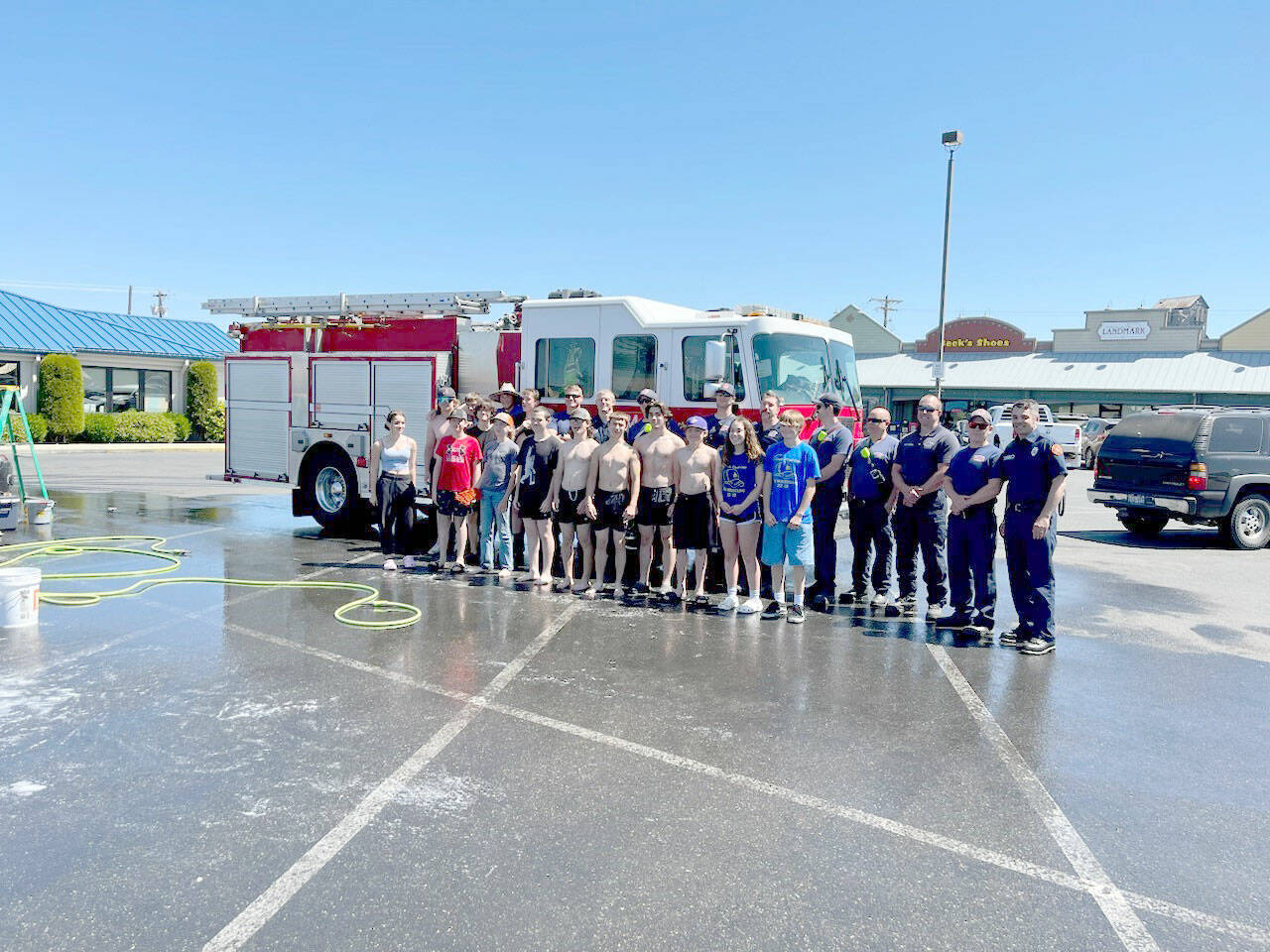 The duty crew from Clallam County Fire District #3 stopped in at the Sequim High School wrestling team’s car wash fundraiser on Saturday, June 3.