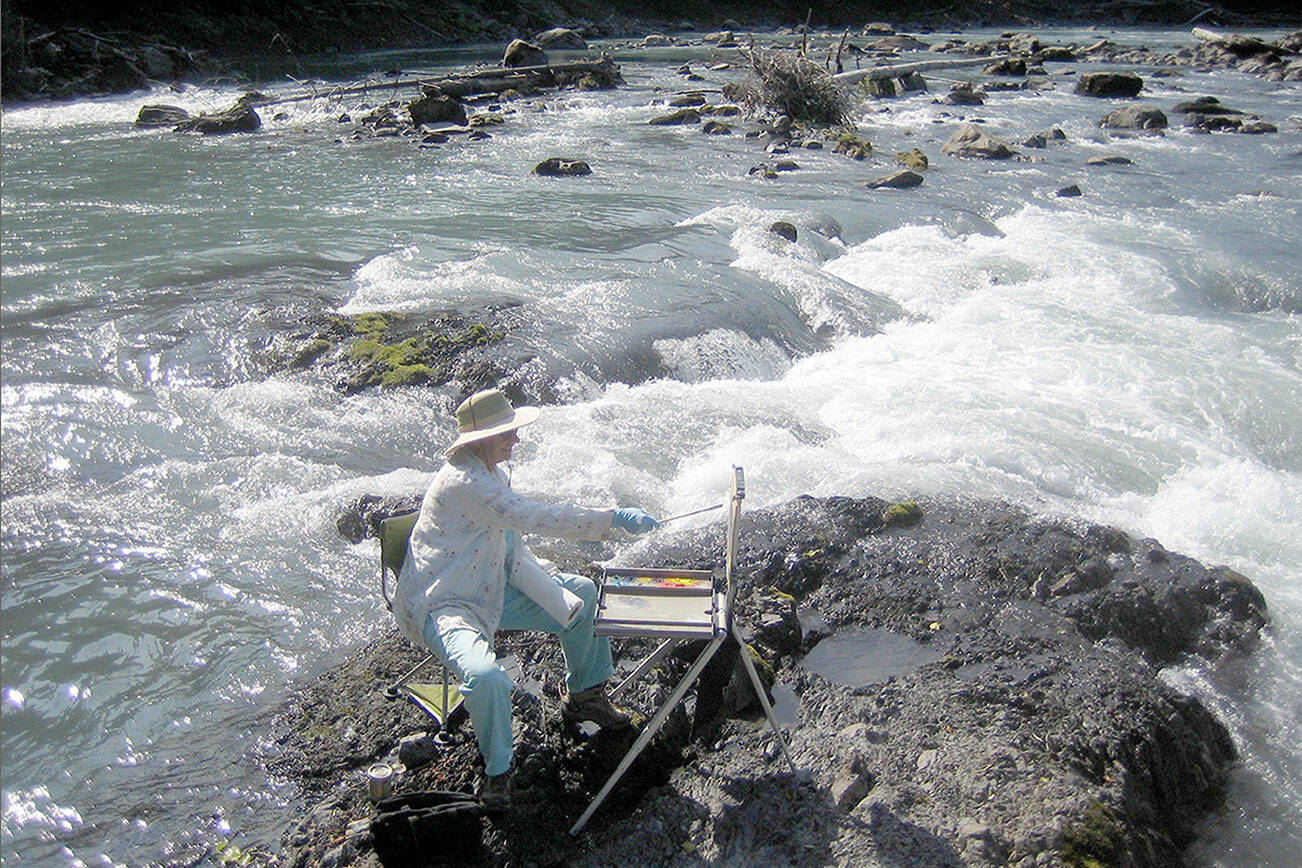 (Northwind Art Kathy Francis painting en plein air):  Northwind Art will host a plein air painting exhibition later this summer in tribute to the late Kathy Francis of Port Townsend, pictured here at the oxbow of the Hoh River. Artists are invited to enter work through July 14. photo courtesy of Bob Francis