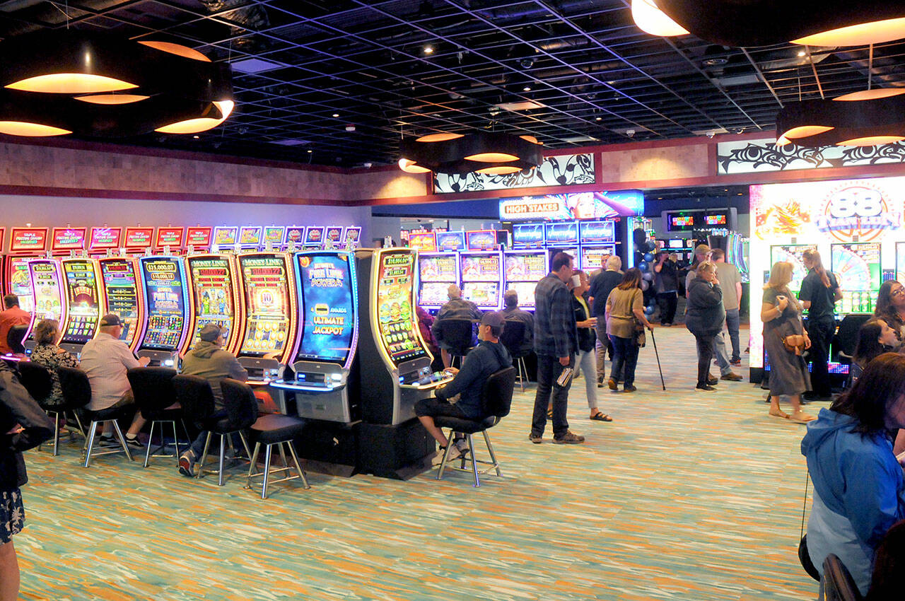 Visitors to the newly-expanded Elwha River Casino walk through the gaming area after it was officially opened on Wednesday on the Lower Elwha Klallam Reservation west of Port Angeles. (KEITH THORPE/PENINSULA DAILY NEWS)