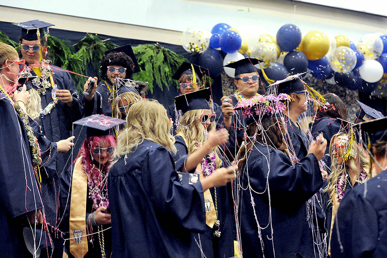 The Forks High School Class of 2023 begins to celebrate at the conclusion of the Commencement Ceremony Saturday afternoon in the Spartan Gym. (Lonnie Archibald/for Peninsula Daily News)