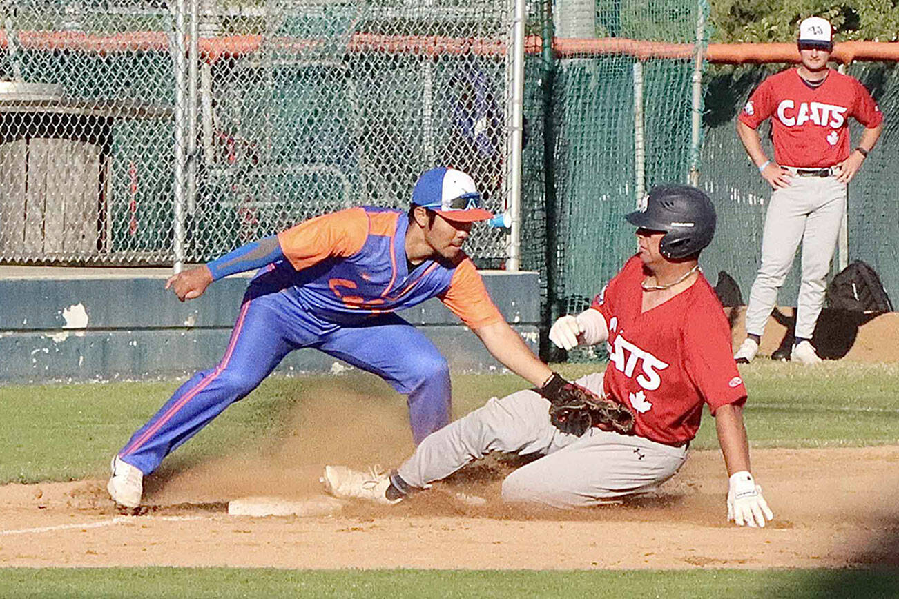 Victoria Harbour Cat Brayden Kessel is tagged out as he attempts to slide into third base. The Lefties 3rd baseman is M.J. Kim who applies the tag dlogan